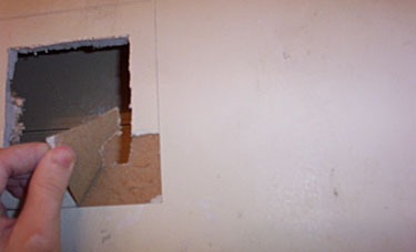 6-Removing paper from wall.