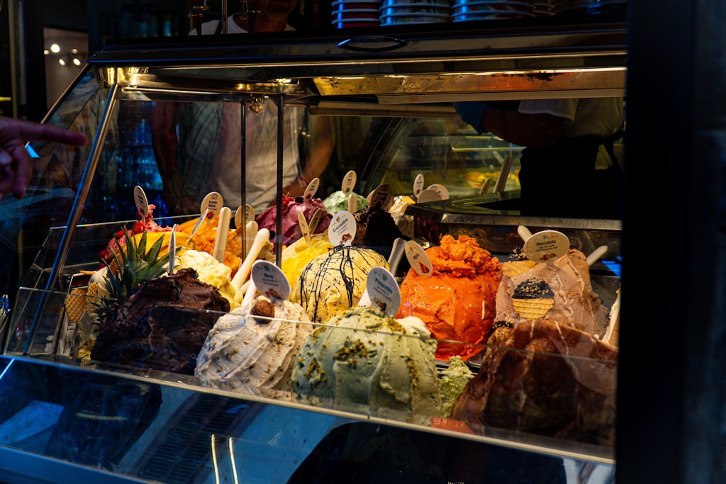 Gelato display case colorful flavors Italy