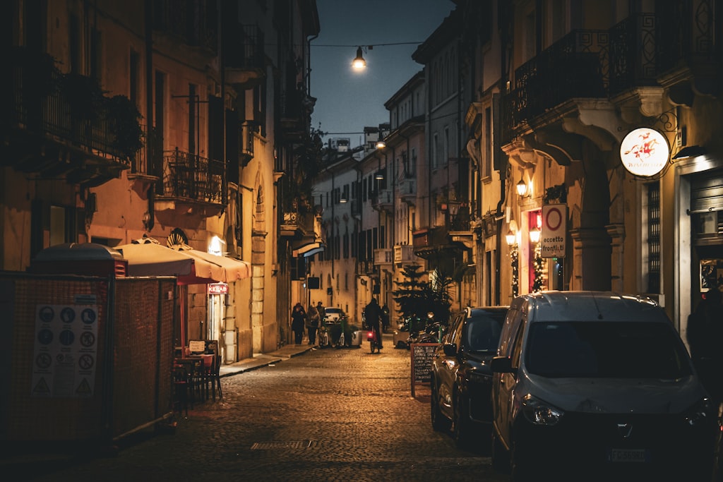 Verona Italy cobblestone street at night