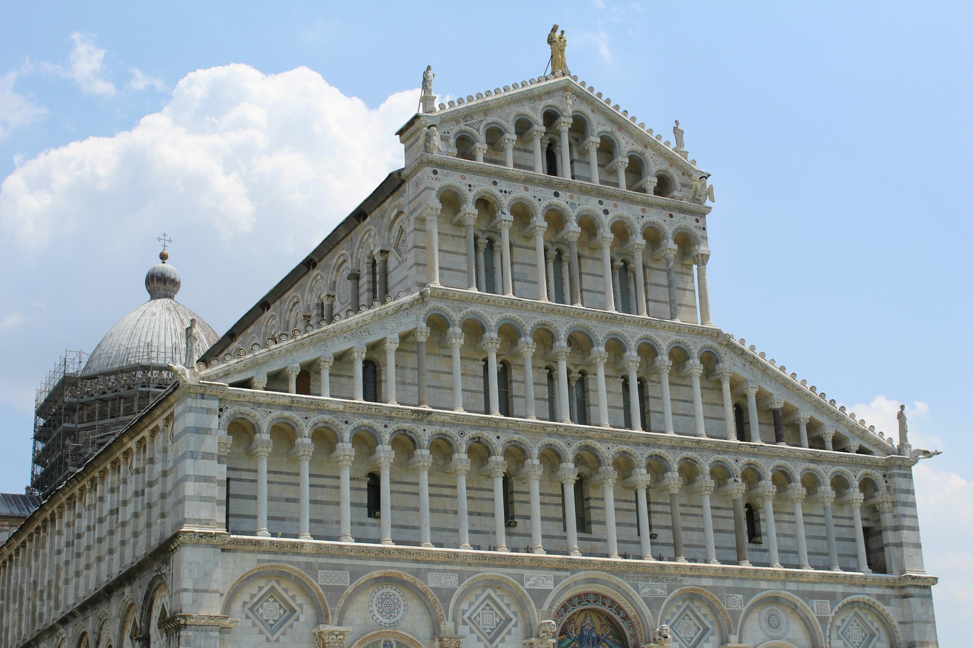 Pisa Cathedral with dome blue sky