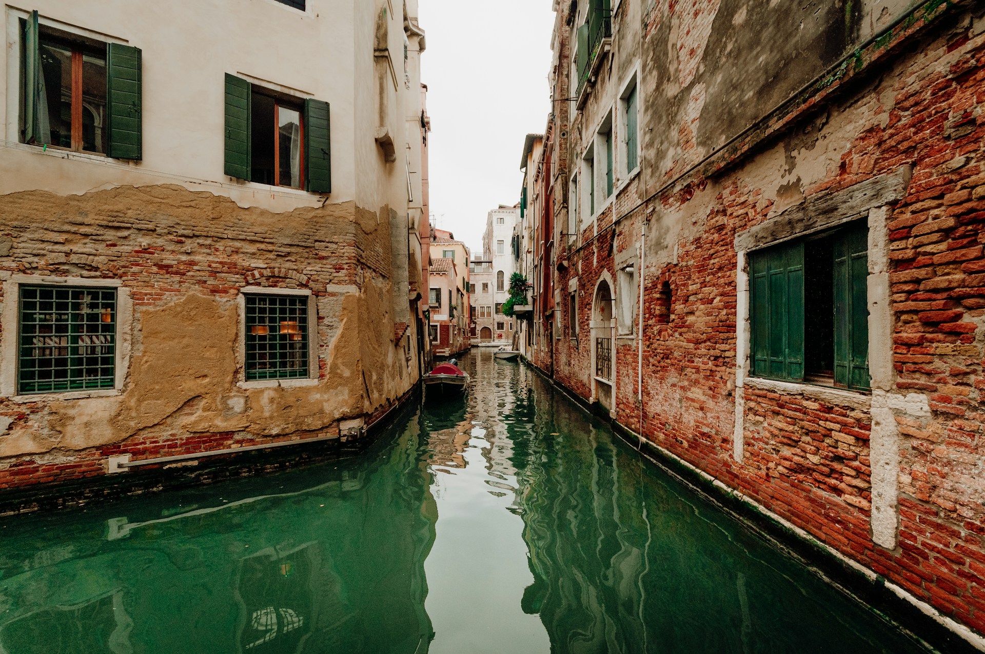 Narrow canal Venice Italy gondola buildings
